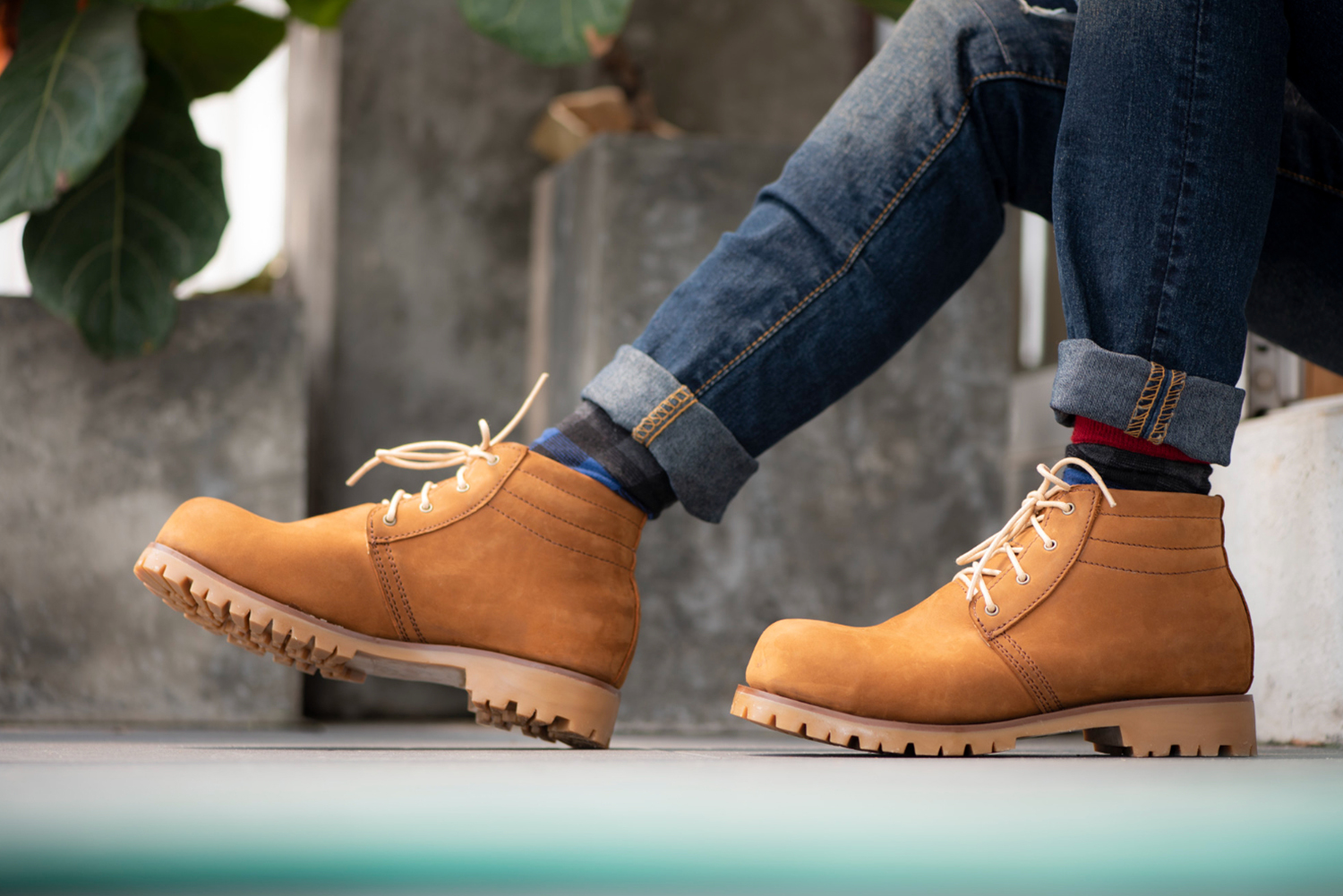 model-wearing-blue-jeans-yellow-boots-floor edit